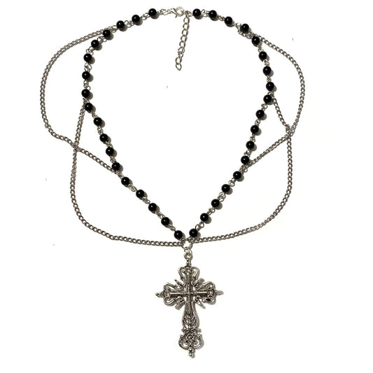 Necklace with black beads and cross