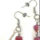 Earrings with red hearts and a chrome cross charm