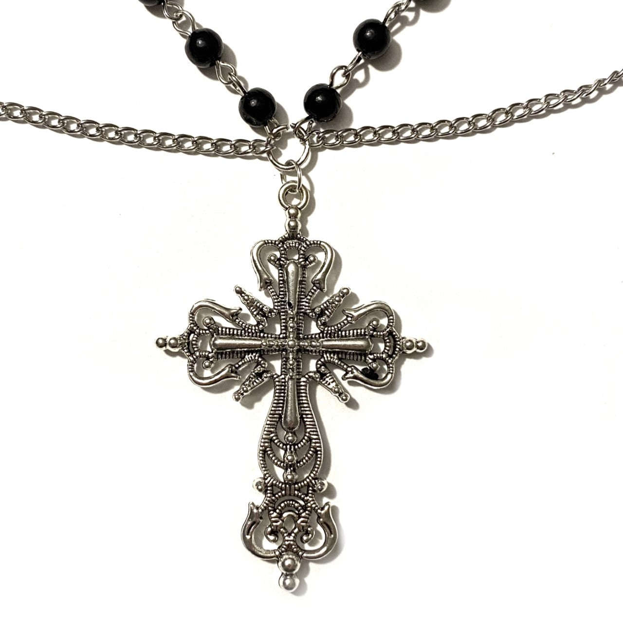 Necklace with black beads and cross