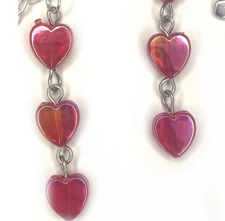 Earrings with red hearts and a chrome cross charm