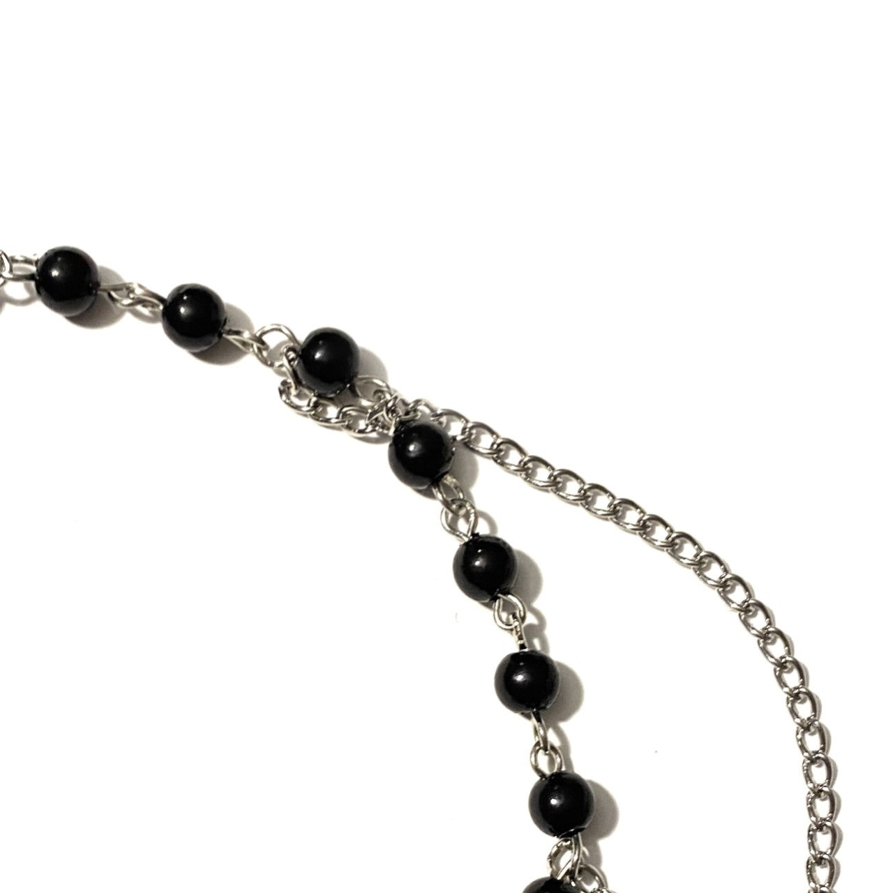 Necklace with black beads and cross