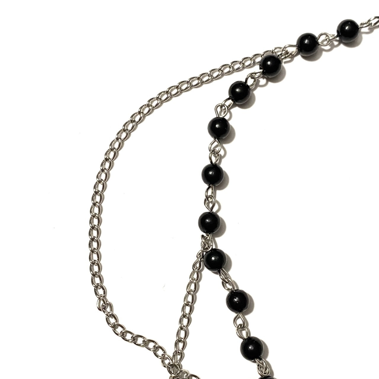 Necklace with black beads and cross