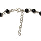 Necklace with black beads and cross